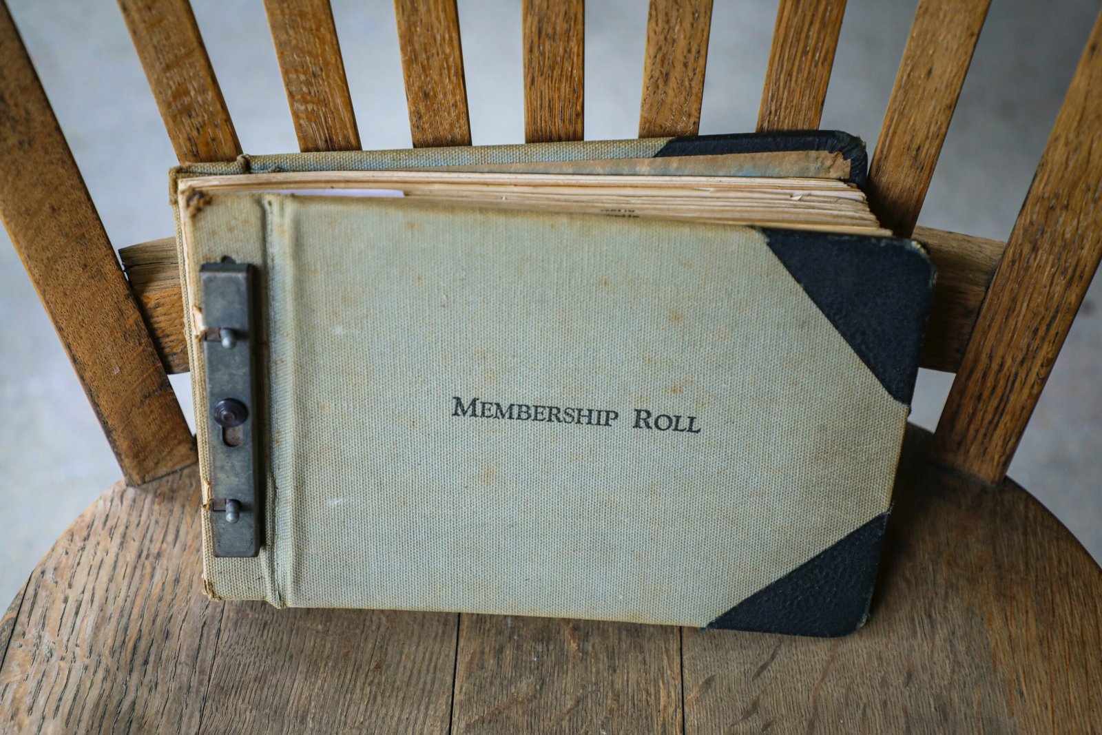 a book sitting on top of a wooden chair